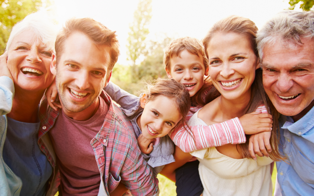A multi-generational family discussing business continuity, partnering with Meritus Group Business Brokerage to ensure their legacy thrives.