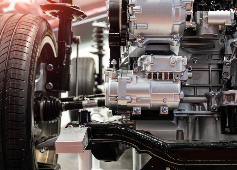 A modern automotive workshop with a "For Sale" sign, emphasizing the collaboration with Meritus Group Business Brokerage.