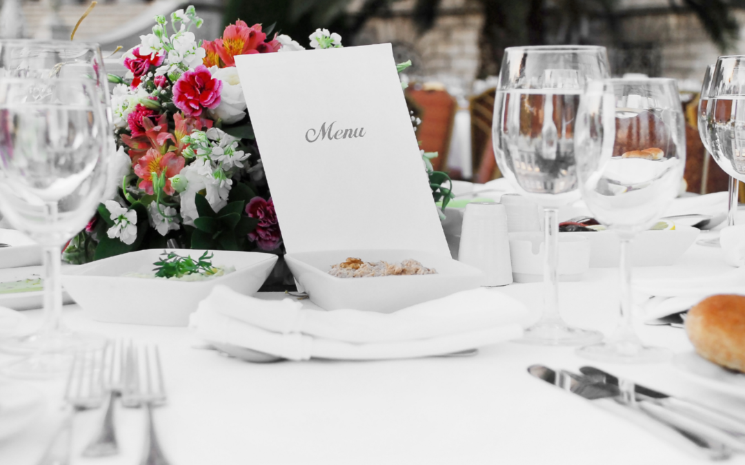 Event professionals discussing the sale of a catering and event venue, highlighting Meritus Group's expertise in facilitating successful transactions.