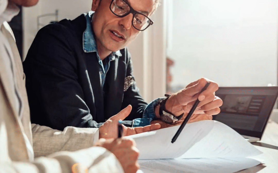 Business owner and advisor discussing asset vs. stock sale deal structure options